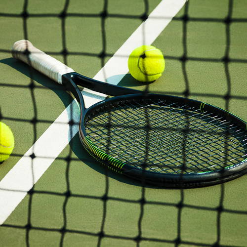 Badminton racket on tennis court